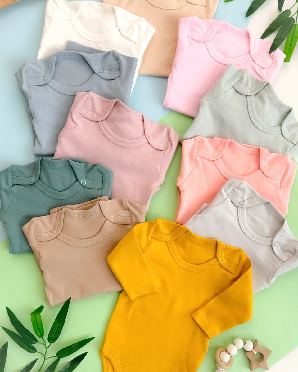 Omuzlardan çıtçıtlı desensiz uzun kollu mevsimlik penye çıtçıtlı badi 