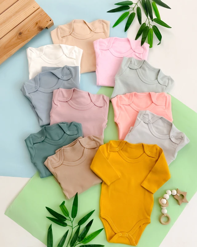 Omuzlardan çıtçıtlı desensiz uzun kollu mevsimlik penye çıtçıtlı badi 